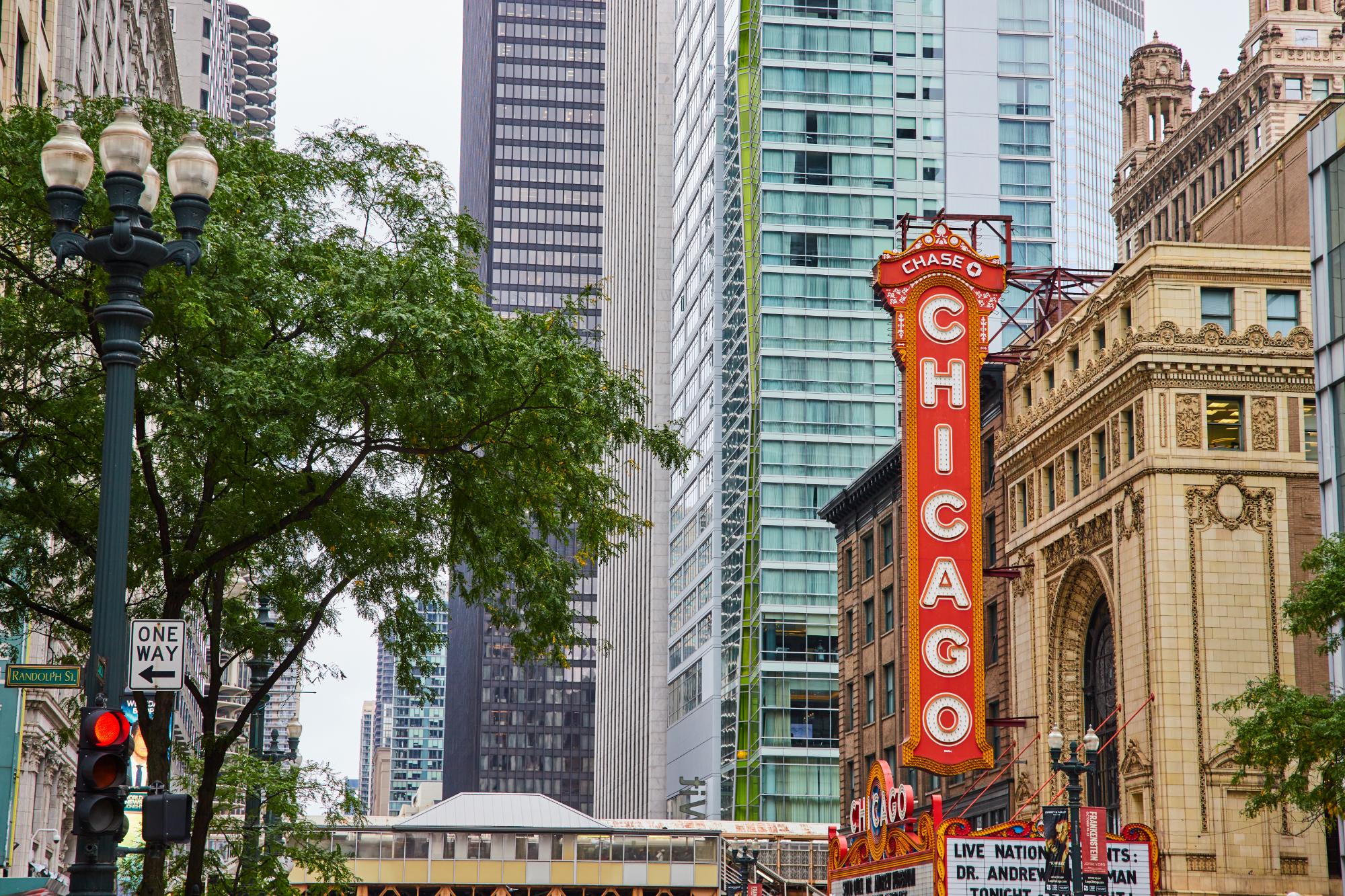Large orange sign with Chicago in white lettering in downtown of city, historic building Large Orange Sign Chicago